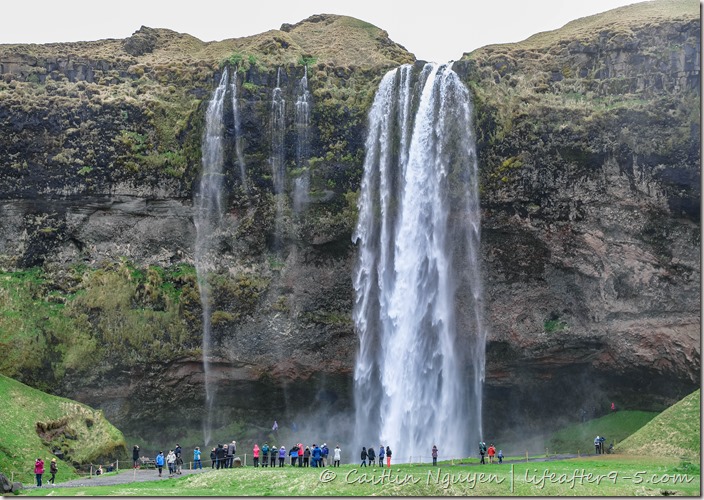 People standing in front of Seljalandsfoss